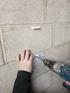 Drilling hole in concrete block