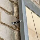 Galvanised Banding Builders All Round Steel Fixing Strap on a window