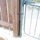 Galvanised Banding Builders All Round Steel Fixing Strap on a gate post