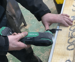 Multi Tool Blade cutting into plasterboard and timber