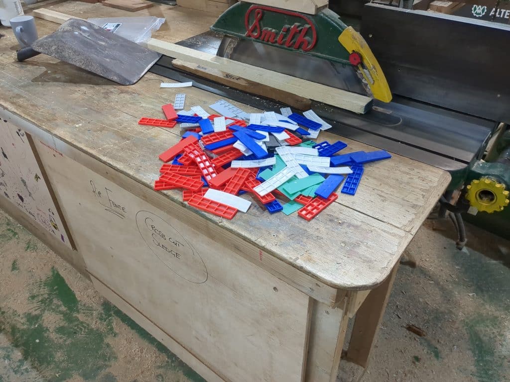 Flat Packers Plastic Plastic packers on saw bench